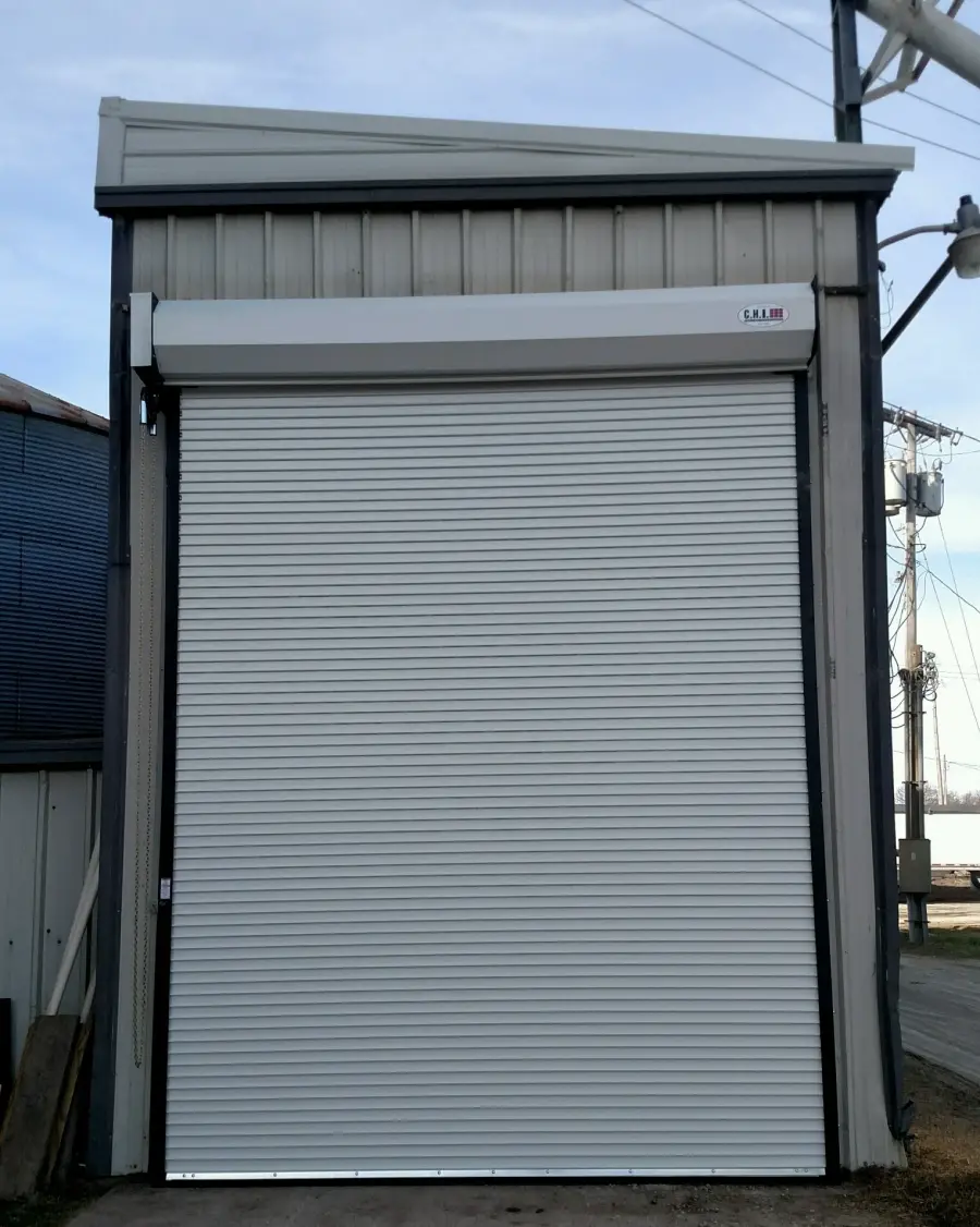 Interior view of a gray rolling door and its guides